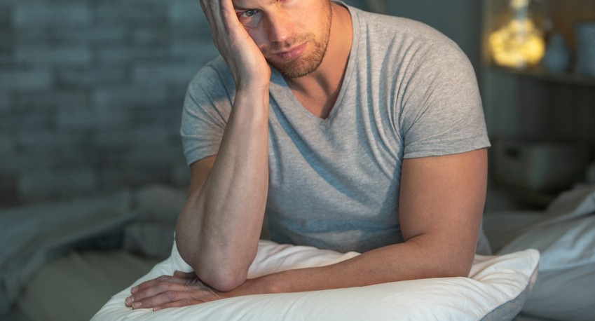 stressed man who needs a rental dumpster for his junk
